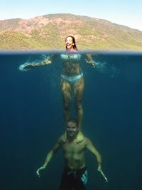 Couple swimming in sea