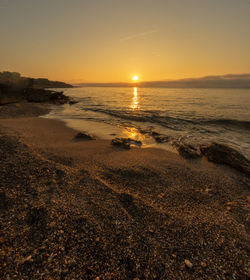 Scenic view of sea against sky during sunset