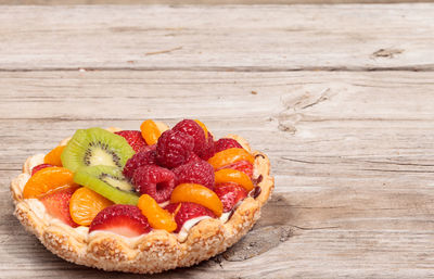 Close-up of fruit tart on wooden table