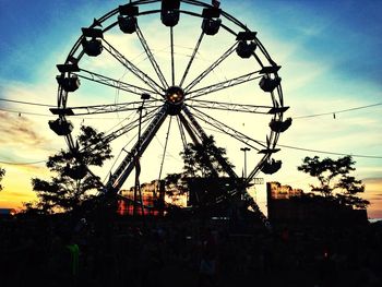 Low angle view of ferris wheel against sky