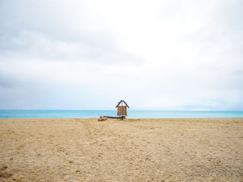 Cute hut between beach and sky horizon