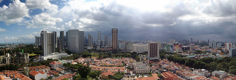 Cityscape against cloudy sky