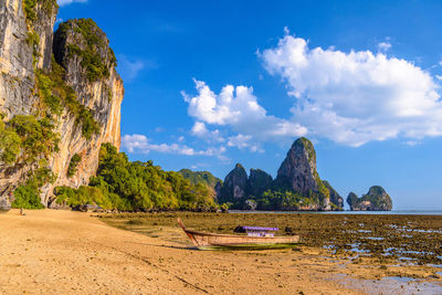 Scenic view of sea and mountains against sky