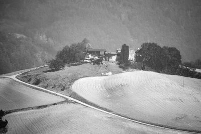 Road amidst trees against sky