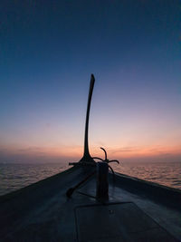 Scenic view of sea against clear sky at sunset