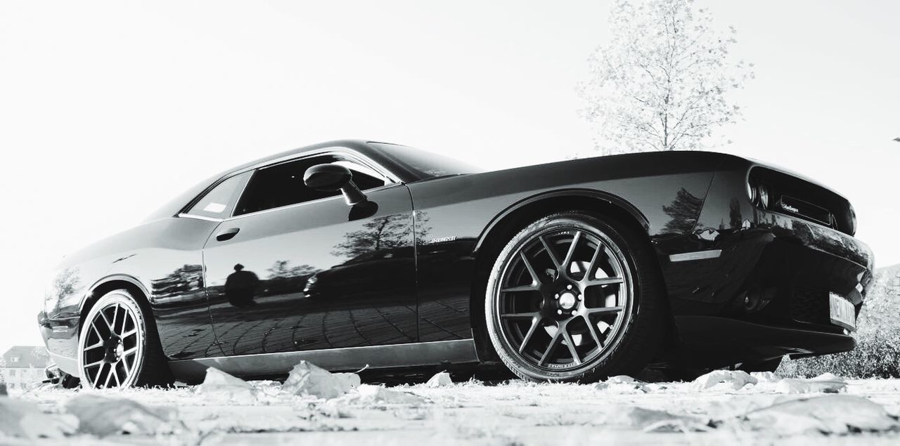 CLOSE-UP OF VINTAGE CAR ON SNOW