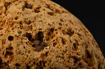 Close-up of ice cream over black background