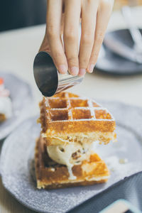 Midsection of person holding ice cream