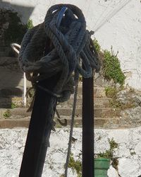 Close-up of rope tied on wooden post