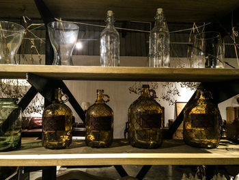 Glass bottles in shelf