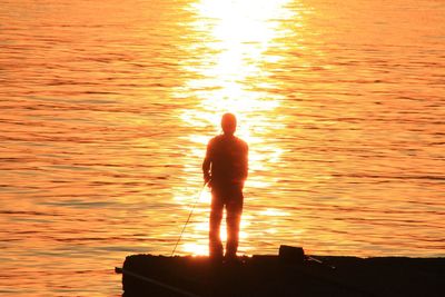 Scenic view of sea at sunset