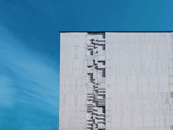 Low angle view of building against blue sky