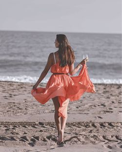 Rear view of woman on beach