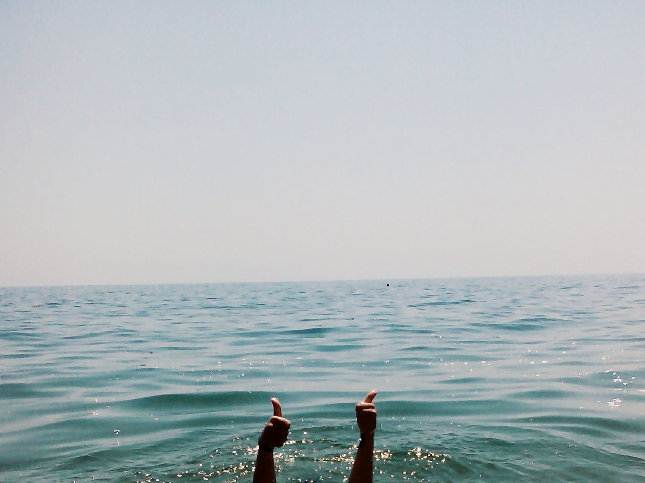 water, sea, horizon over water, lifestyles, leisure activity, scenics, tranquility, tranquil scene, nature, beauty in nature, vacations, idyllic, rippled, outdoors, sky, day, seascape, remote, casual clothing, ocean, calm