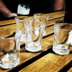 Close-up of wine glasses on table