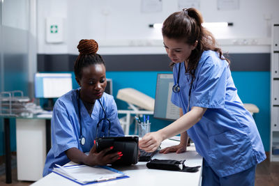 Doctor working at table