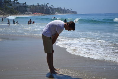 Full length of man standing on beach