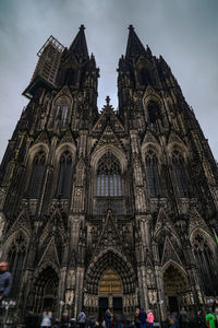 Low angle view of cathedral against cloudy sky