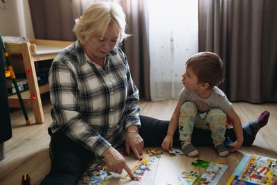 Mother playing with toys at home