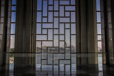 Reflection of building on glass window