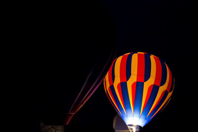 Low angle view of hot air balloon at night