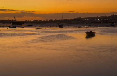 Scenic view of sea against orange sky