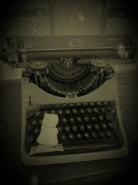 High angle view of old machinery on table