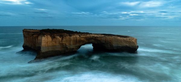 Scenic view of sea against cloudy sky
