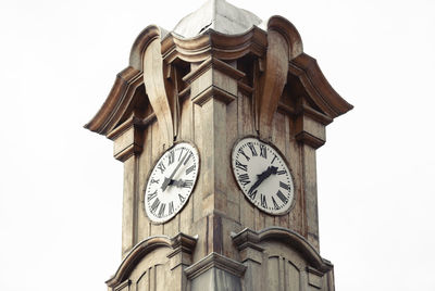 Low angle view of clock tower against sky