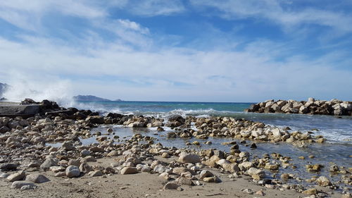 Scenic view of beach against sky