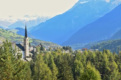 Panoramic view of trees and mountains against sky