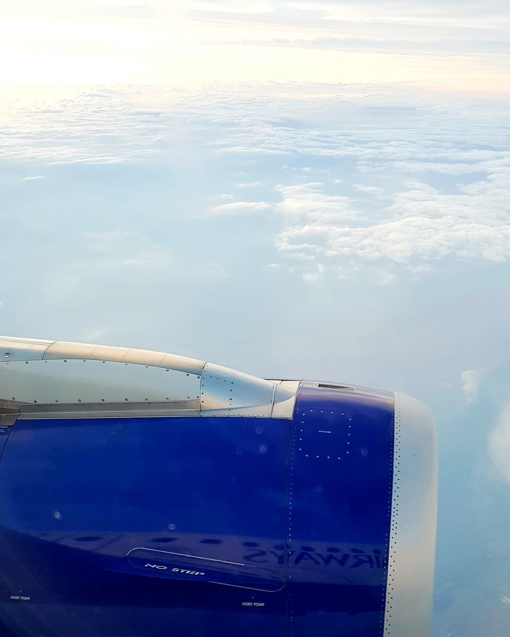 AERIAL VIEW OF SEA AND AIRPLANE AGAINST SKY