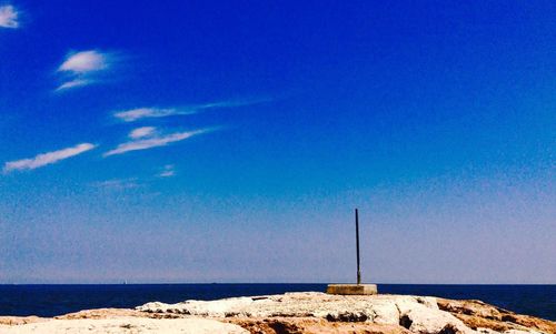 Scenic view of sea against blue sky