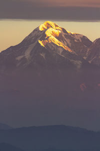 Scenic view of mountain range against sky during sunset