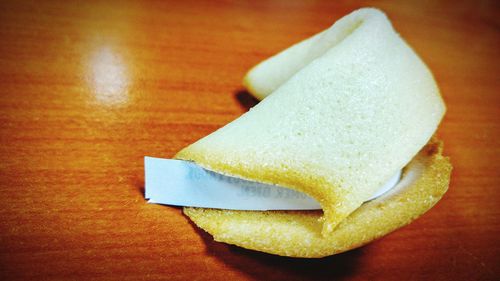 Close-up of a fortune cookie on table