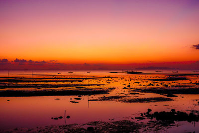 Scenic view of sea against clear sky during sunset