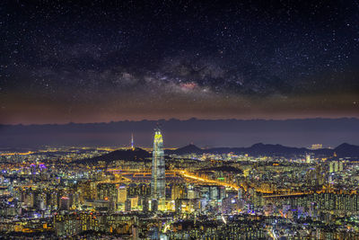 Illuminated buildings in city at night