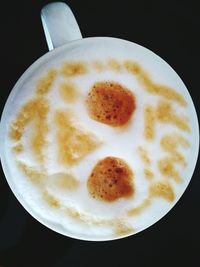 Close-up of cappuccino on table
