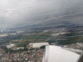 Close-up of wet window in rainy season