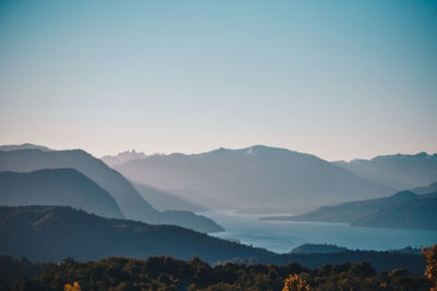 Scenic view of silhouette mountains against sky during sunset