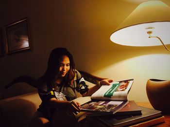 Portrait of woman in illuminated room