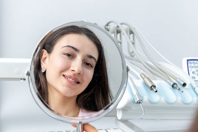 Portrait of young woman in bathroom