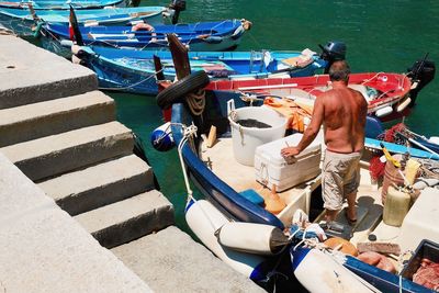 High angle view of boats moored at shore