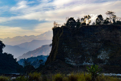 Scenic view of mountains against cloudy sky