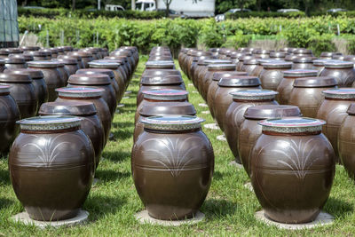 Pottery arranged on grassy field