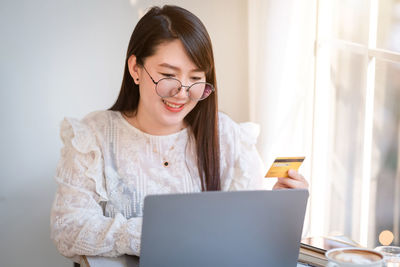 Young woman using mobile phone
