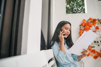 Young woman using phone