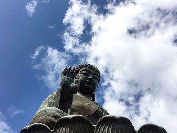 Low angle view of statue against sky