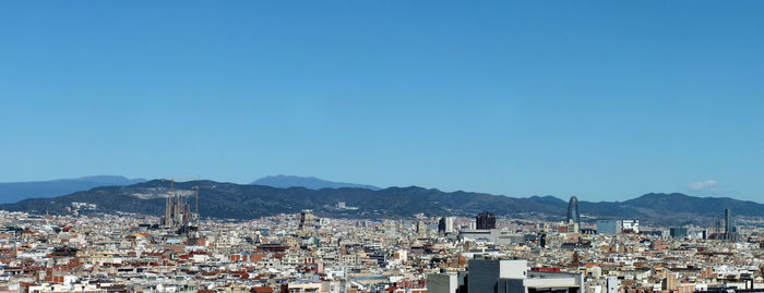 Townscape against clear blue sky