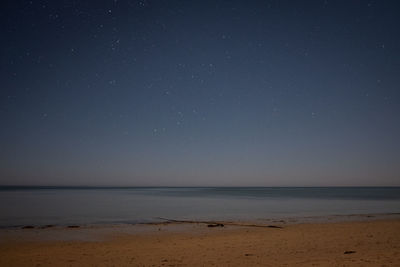 Scenic view of sea against sky at night